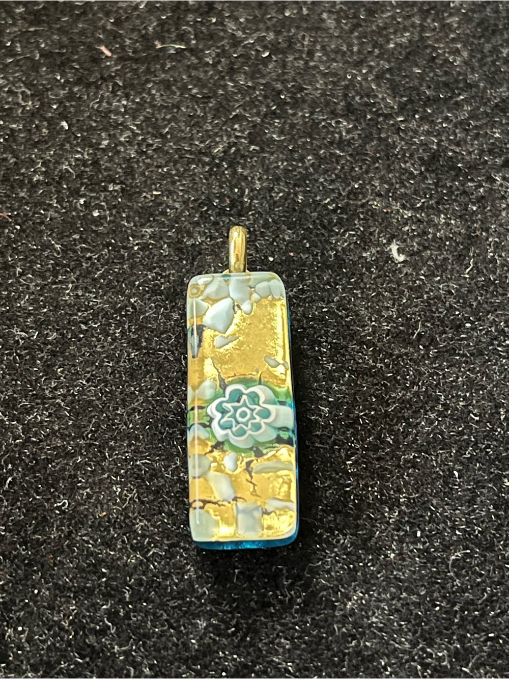 GlassOfVenice Murano glass stick pendant featuring a floral millefiori design.
